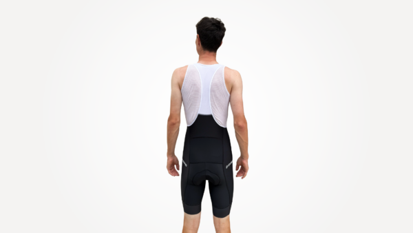 Cuissard technique noir avec bretelles, aperçu arrière d'un cycliste en tenue de sport.