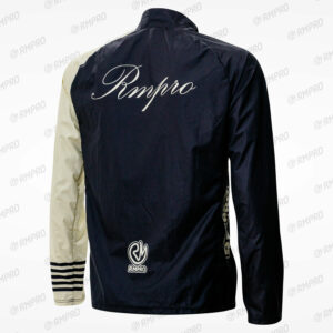 Veste coupe-vent noire et beige avec logo Rmpro, conçue pour le cyclisme et personnalisable.