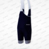 Cuissard technique bleu marine avec bretelles, logo visible, adapté pour le cyclisme.